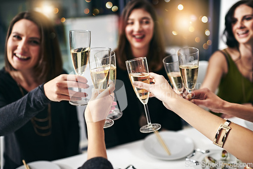 Image of Food, party and champagne with friends at restaurant for celebration, wine and social event. Happy, diversity and toast with group of people eating together for fine dining, cheers and free time