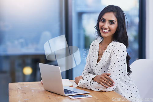 Image of Business, portrait and Indian woman with a laptop, startup success or planning for a project, connection or development. Face, female employee or entrepreneur with technology, modern office or growth