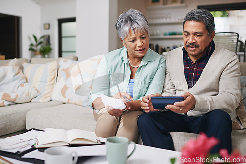 Image of Elderly couple, financial debt and life insurance discussion with banking document and bills. Retirement fund, senior people and communication in a home living room with paperwork and contract