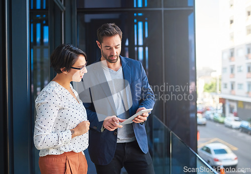 Image of People with tablet, business meeting and teamwork with strategy, technology and digital agenda at city office. Collaboration, professional man and woman working together with online project planning