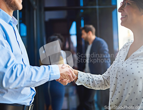 Image of Handshake, business people in meeting and partnership, trust in team and onboarding or hiring. Professional agreement, deal and collaboration with man and woman shaking hands, teamwork and thank you