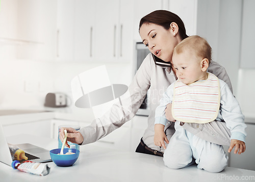 Image of Family, baby and mother with multitasking, home and phone call with stress, feeding toddler and burnout. Mama, female parent and infant in the kitchen, smartphone and communication with frustration