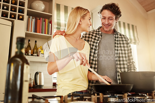 Image of Speaking, support or happy couple kitchen cooking with healthy food for lunch together at home. Affection, love or woman helping, smiling or talking to husband in meal preparation in Australia