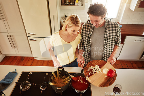 Image of Top view, food or happy couple in a kitchen cooking with healthy vegetables for dinner meal together at home. Love or woman helping or talking to mature husband in lunch diet preparation in Australia