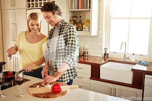 Image of Smile, food or happy couple in the kitchen cooking with healthy vegetables for lunch or dinner together. Love or woman helping or talking to mature husband in meal preparation at home in Australia