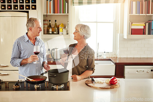 Image of Wine, happy or old couple cooking food for a healthy vegan diet together with love in retirement at home. Smile, support or senior woman drinking or talking in house kitchen with husband at dinner