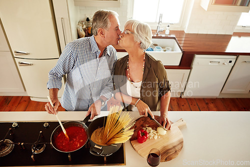 Image of Top view, kiss or old couple kitchen cooking with healthy food for lunch or dinner together at home. Love, help or senior woman bonding or kissing mature husband in meal preparation in retirement