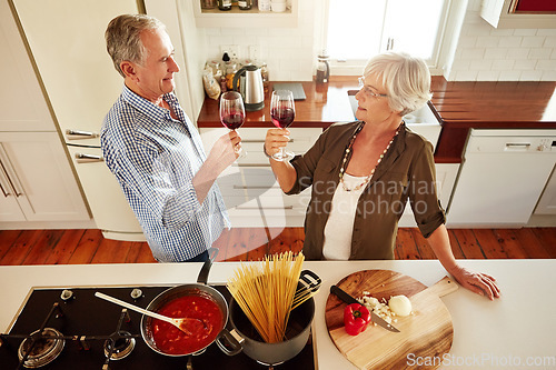 Image of Toast, wine or old couple cooking food for healthy vegan diet together in retirement at home. Above, cheers or romantic senior woman drinking or toasting in kitchen with a happy husband at dinner