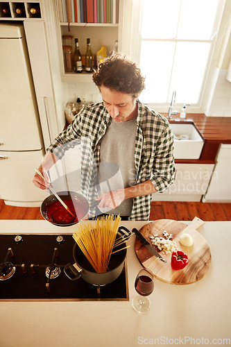 Image of Spaghetti, cooking or above of man in kitchen with healthy vegan diet for nutrition or vegetables at home in Australia. Wine glass, food or male person in house kitchen in preparation for dinner meal