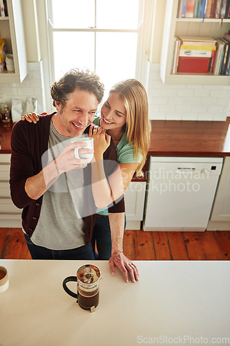 Image of Hugging, coffee or happy couple laughing in kitchen at home bonding or enjoying quality time together. Embrace, affection or above of funny mature man relaxing or drinking tea with woman at home