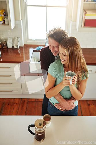 Image of Hugging, coffee or happy couple speaking in kitchen at home bonding or enjoying quality time together. Embrace, affection or above of mature man relaxing or drinking espresso tea with woman at home