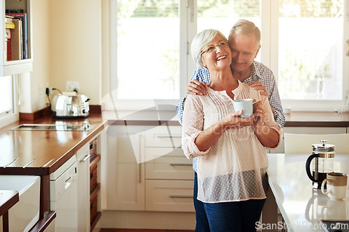 Image of Hugging, coffee or old couple laughing in kitchen at home bonding or enjoying quality time together. Embrace, retirement or happy mature man talking, relaxing or drinking tea with funny senior woman