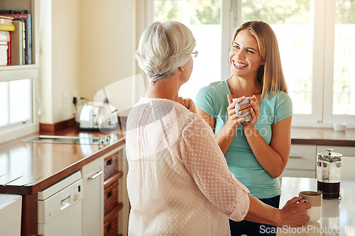 Image of Mother, coffee or happy woman laughing in kitchen in family home bonding or enjoying quality time together. Speaking, retirement or funny girl talking, relaxing or drinking tea with senior parent