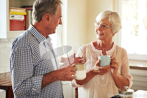 Image of Chat, coffee or old couple talking in kitchen at home bonding or enjoying quality morning time together. Happy, retirement or senior man speaking, relaxing or drinking tea espresso with woman at home