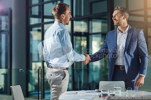 Image of Handshake, business people and meeting success or recruitment, employment and hiring in office. Corporate, men and executive shaking hands with new employee or collaboration on deal or partnership