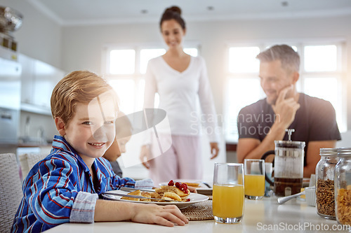 Image of Child, portrait and pancakes for breakfast in a family home with love, care and happiness at a table. A happy woman, man and kids eating food together in morning for health, happiness and wellness