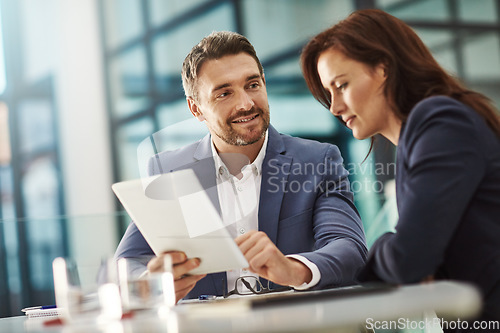 Image of Collaboration, tablet and meeting with a business team in the office for research on a company project. Teamwork, technology and brainstorming with corporate people planning a strategy at work