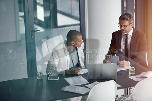 Image of Planning, tablet and business man with partner in conference room, meeting or discussion of corporate, finance data. Professional people, leader or accountant on digital tech app for financial advice