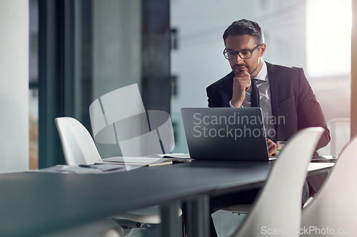 Image of Business man, computer and thinking, ideas and reading online for decision, choice or solution in review or report. Planning, focus and problem solving of corporate person or ceo on laptop in office