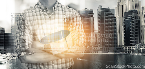 Image of Business man, double exposure and arms crossed by city skyline with entrepreneur, career or urban overlay. Businessman, ceo and holographic cityscape with metro buildings at workplace with lens flare