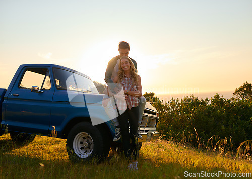 Image of Couple, portrait and sunset by pickup truck in nature for road trip with love, romance and date on adventure. Man, woman and hug for freedom, journey and transportation for travel in countryside