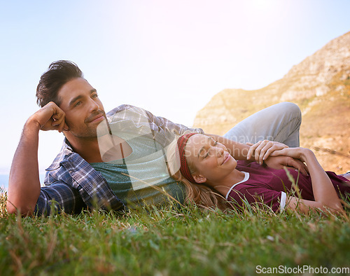 Image of Relax, smile and love with couple in nature for mountains, bonding and affectionate. Happiness, date and romance with man and woman cuddle in grass field for summer break, happy and relationship