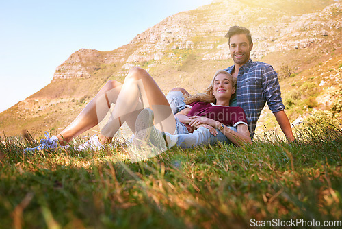 Image of Relax, love and portrait of couple in nature for carefree, bonding and affectionate. Happiness, date and romance with man and woman cuddle in grass field for summer break, happy and mountains