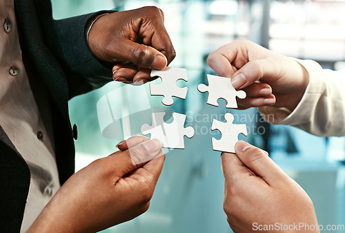 Image of Puzzle, team building and hands of business people for strategy, partnership and solution. Work, corporate and a group of employees with a jigsaw for an idea, mission or company problem solving