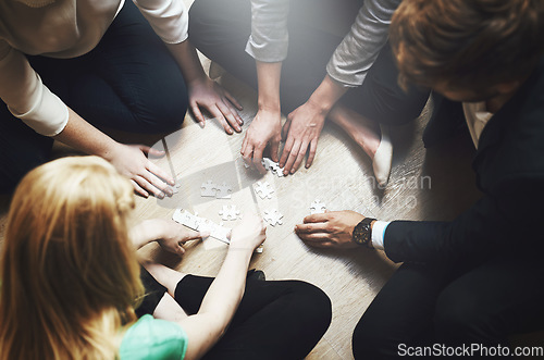 Image of Puzzle, group and teamwork of people solution, collaboration and workflow, problem solving and thinking. Team building game, project development and women in circle on floor, synergy or brainstorming