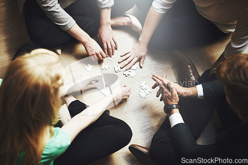 Image of Puzzle, group and people thinking, teamwork and solution, collaboration or workflow in problem solving and challenge. Team building games, project development and women or men in circle brainstorming