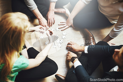 Image of Puzzle, teamwork and group of people thinking, planning or solution, collaboration or problem solving and challenge. Team building games, project workflow and women, men or circle brainstorming above