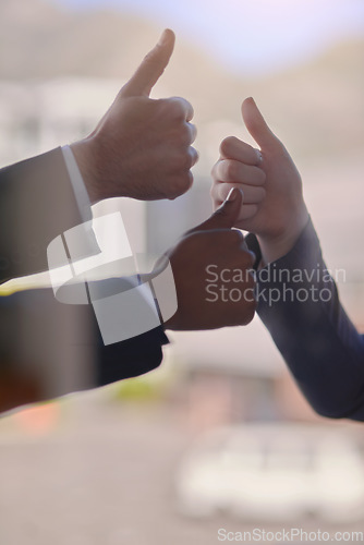 Image of Closeup, hands and thumb up with business, feedback and success with report, cooperation and agreement. Zoom, professional and group with teamwork, collaboration and partnership with achievement