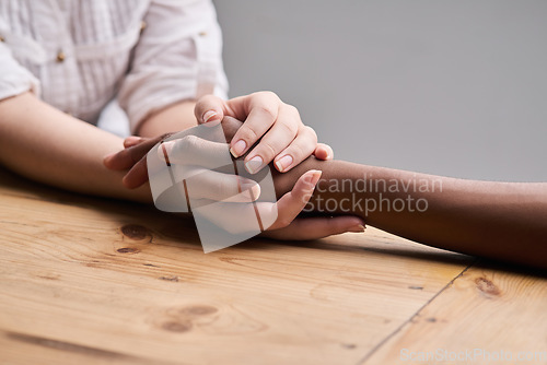 Image of Support, comfort and people holding hands for empathy, love and trust together. Help, table and diversity with a helping hand from life coach, care of friends and showing compassion for mental health