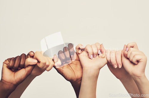 Image of Mockup, hands and group holding thumb, support and community against a studio background. Zoom, people or friends with teamwork, solidarity or partnership with collaboration, fingers or cooperation