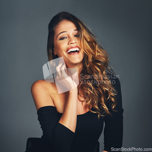 Image of Portrait, smile and woman with hair care, natural beauty and laughing against a dark studio background. Face, female person and girl with cosmetics care, treatment and luxury with salon grooming
