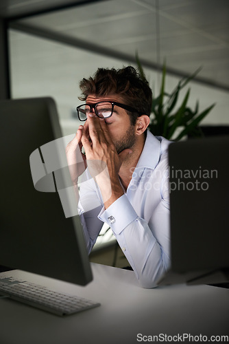 Image of Tired, night and a businessman with a headache at work, deadline burnout and frustrated. Stress, problem and a corporate employee in a dark office with anxiety or depression from an email on a pc