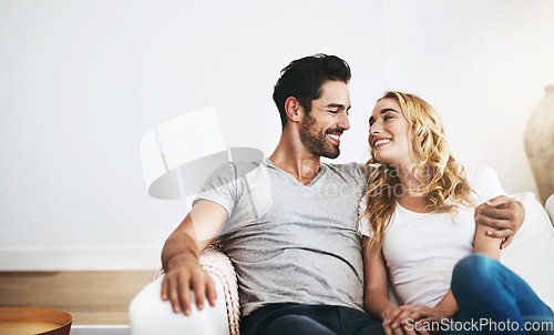 Image of Smile, relax or happy couple hugging on house sofa bonding or smiling with trust or loyalty together. Smile, lovers or woman enjoys quality time with a romantic man on couch on weekend break at home