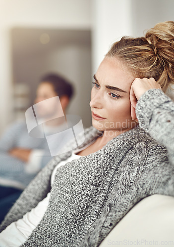 Image of Argument, stress and sad woman in a fight with her boyfriend in the living room of their apartment. Divorce, depression and young female person with conflict or breakup i couple therapy for marriage