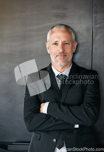 Image of Businessman, portrait and happy with a smile on face with arms crossed in studio. A senior entrepreneur or executive person on a grey wall with corporate clothes, positive mindset and career pride