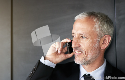 Image of Business man, happy and phone call or communication with contact and network. Face of a senior entrepreneur person on a grey wall with a cellphone for conversation and thinking about corporate idea