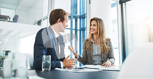 Image of Corporate, staff and employees with collaboration, meeting and feedback in an office, happiness and conversation. Partnership, man and woman with startup success, talking and planning with target