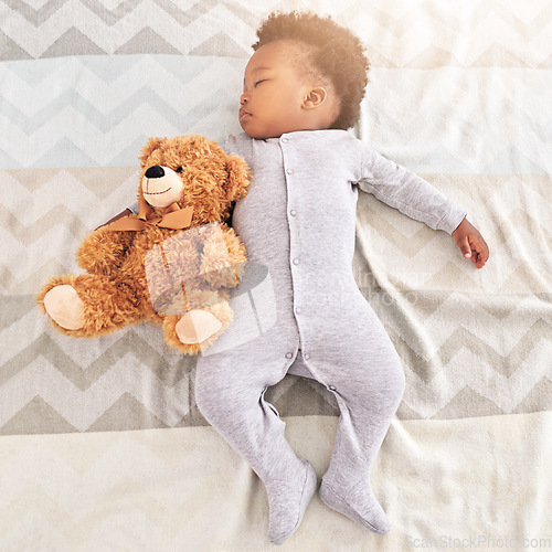 Image of Top view, teddy bear and baby sleeping in bed for rest, nap time and dreaming in nursery. Childcare, newborn and cute, tired and African child with toy in bedroom sleep for comfort, relax and calm