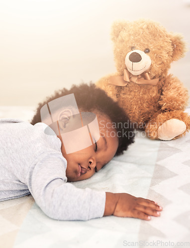 Image of Sleeping, teddy bear and relax with baby in bedroom for carefree, development and innocence. Dreaming, cute and comfortable with african infant and toy at home for morning, resting and bedtime