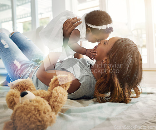 Image of Love, black woman and baby bonding on floor with kiss and happiness playing together in living room. Smile, mother and daughter in happy house, spending quality time for parent and newborn in home.