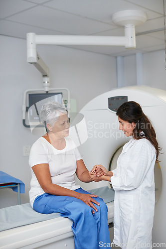 Image of Doctor, mri and woman holding hands of patient in hospital before scanning in machine. Ct scan, comfort or medical professional with senior female person in radiology test for healthcare consultation