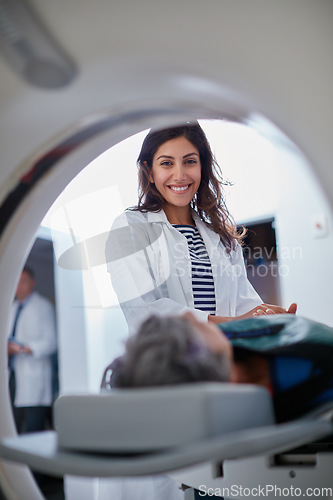 Image of Doctor, mri and portrait of woman with patient to comfort in hospital for machine scanning. Ct scan, holding hands or smile of medical professional with senior person in radiology test for healthcare