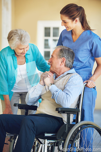 Image of Elderly wife, caregiver or old man in a wheelchair in hospital clinic helping a happy patient for support. Smile, mature woman or healthcare social worker talking to a senior person with a disability