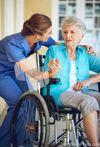 Image of Communication, caregiver or old woman in a wheelchair in hospital helping an elderly patient for support. Speaking, disabled or healthcare social worker talking to a senior person with a disability