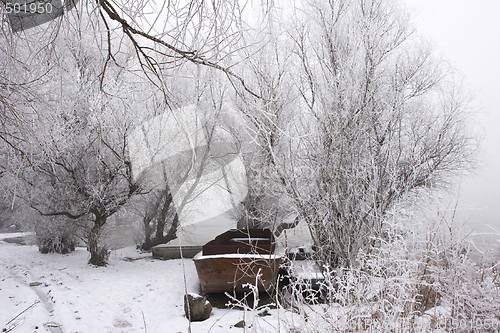 Image of traditional fishing boats on river Danube mid winter