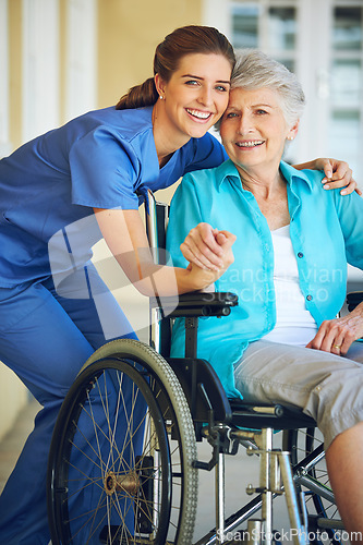 Image of Portrait, caregiver or happy elderly woman in a wheelchair in hospital helping a mature patient for support. Smile, disabled or healthcare social worker smiling with a senior person with a disability